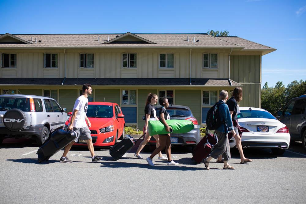 movingandpacking Excited students with suitcases moving into Residence